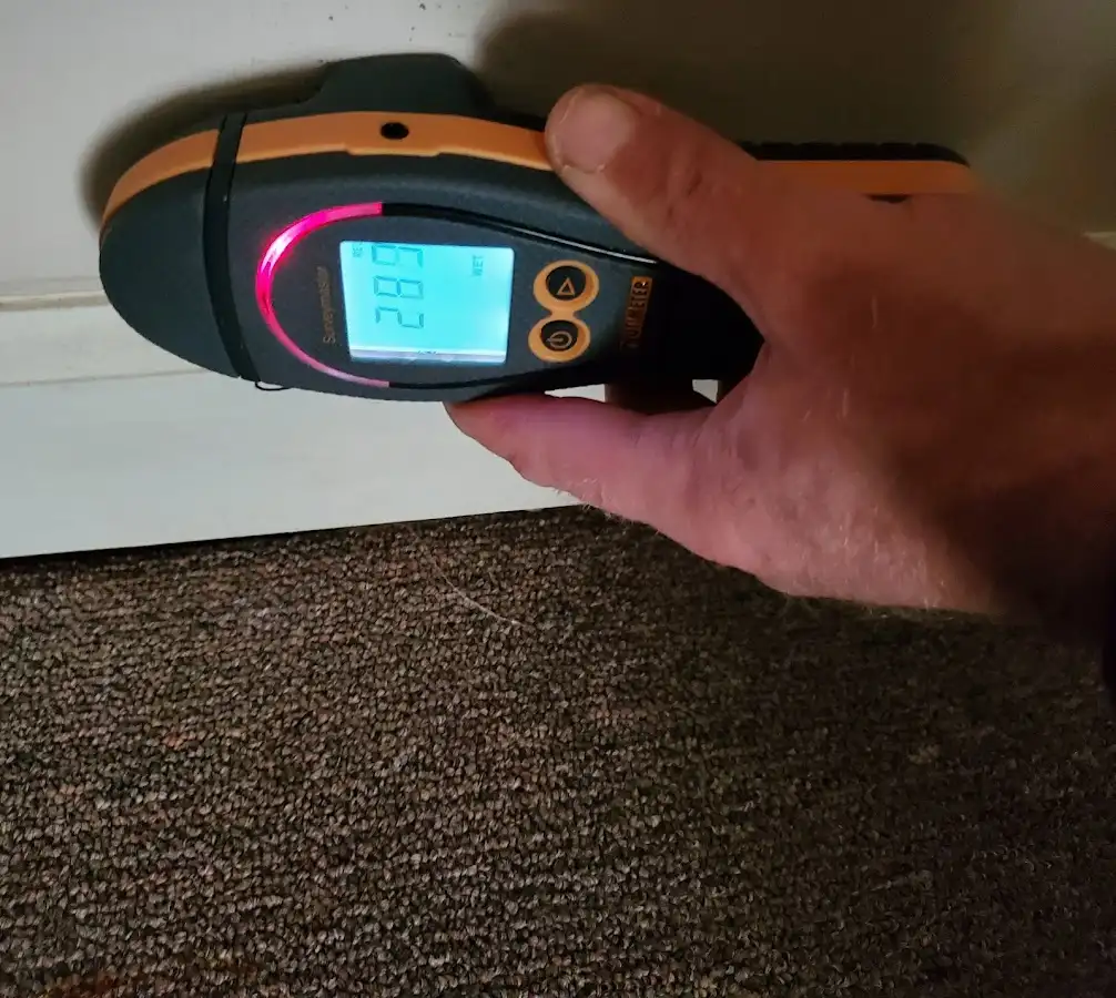 Moisture detection at baseboard during Storm Damage Restoration in Hellam